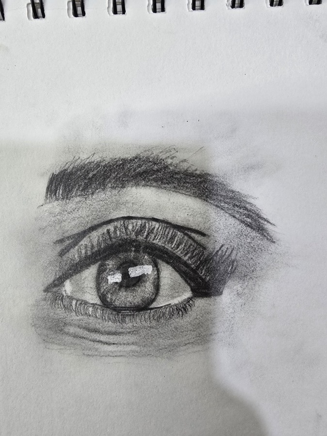 Realistic eye drawn in graphite by a 7-year-old student